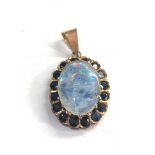 14ct gold opal and sapphire pendant measures approx 24mm by 20 mm not including loop