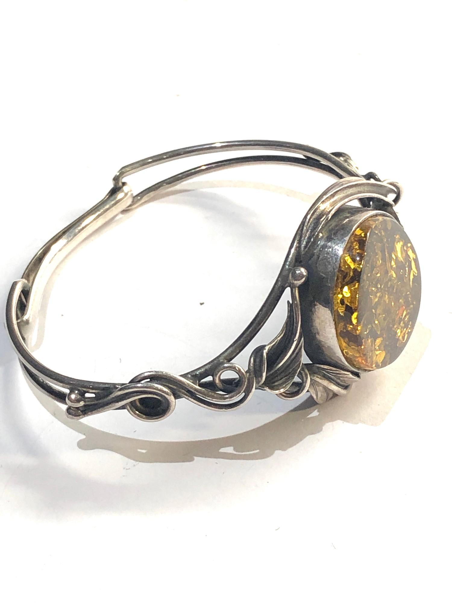 Vintage silver bangle with large amber centre - Image 2 of 3