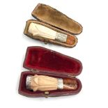 2 boxed silver mounted and amber stem cheroot holders please see images for details