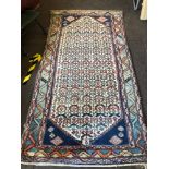 Antique rug measures approx 96" long by 49" wide