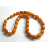 Egg yolk amber bead necklace even sized beads measure approx 15mm by 10mm weight 23g