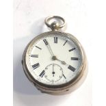 Antique silver key wind open face pocket watch in working order but no warranty given