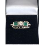 Art deco 14ct white gold and emerald ring each emerald measures approx 5mm by 4mm diamond approx 4mm