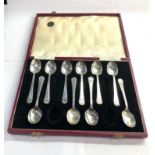 Boxed set of 10 silver tea spoons missing 2