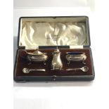 Boxed silver walker and hall cruet set with blue glass liners
