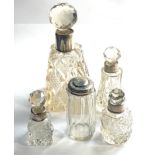 Selection of antique silver top bottles