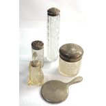 Selection of silver items includes silver top bottles and small silver mirror