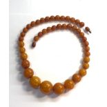 Egg yolk butterscotch amber type bead necklace largest bead measures approx 21mm dia weight 55g