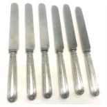 6 Large silver handled table knives