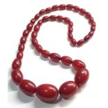 Antique Cherry amber / bakelite bead necklace largest bead measures approx 30mm by 21mm graduated