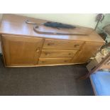 Vintage 2 door 3 draw teak Ercol Sideboard measures approx 61ins height 27ins