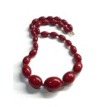 Antique Cherry amber / bakelite bead necklace largest bead measures approx 21mm by 16mm graduated
