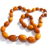 Antique Egg yolk amber bead necklace weight 39g