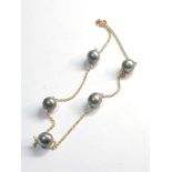 18ct gold black pearl necklace