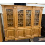 Large pine break front glazed bookcase measures approx 100ins wide by 85ins high