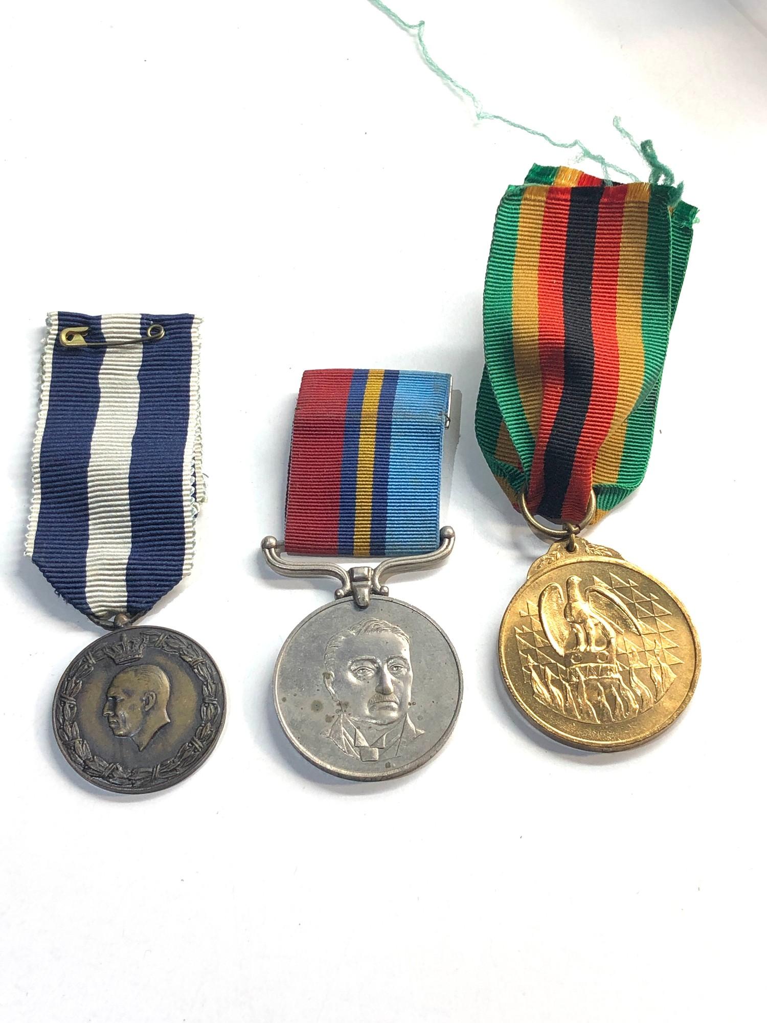 3 vintage medals inc ww2 greek ,zimbabwe rhodesia, the zimbabwe medal rim reads:25535 E R PO S G
