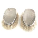 2 antique silver brushes