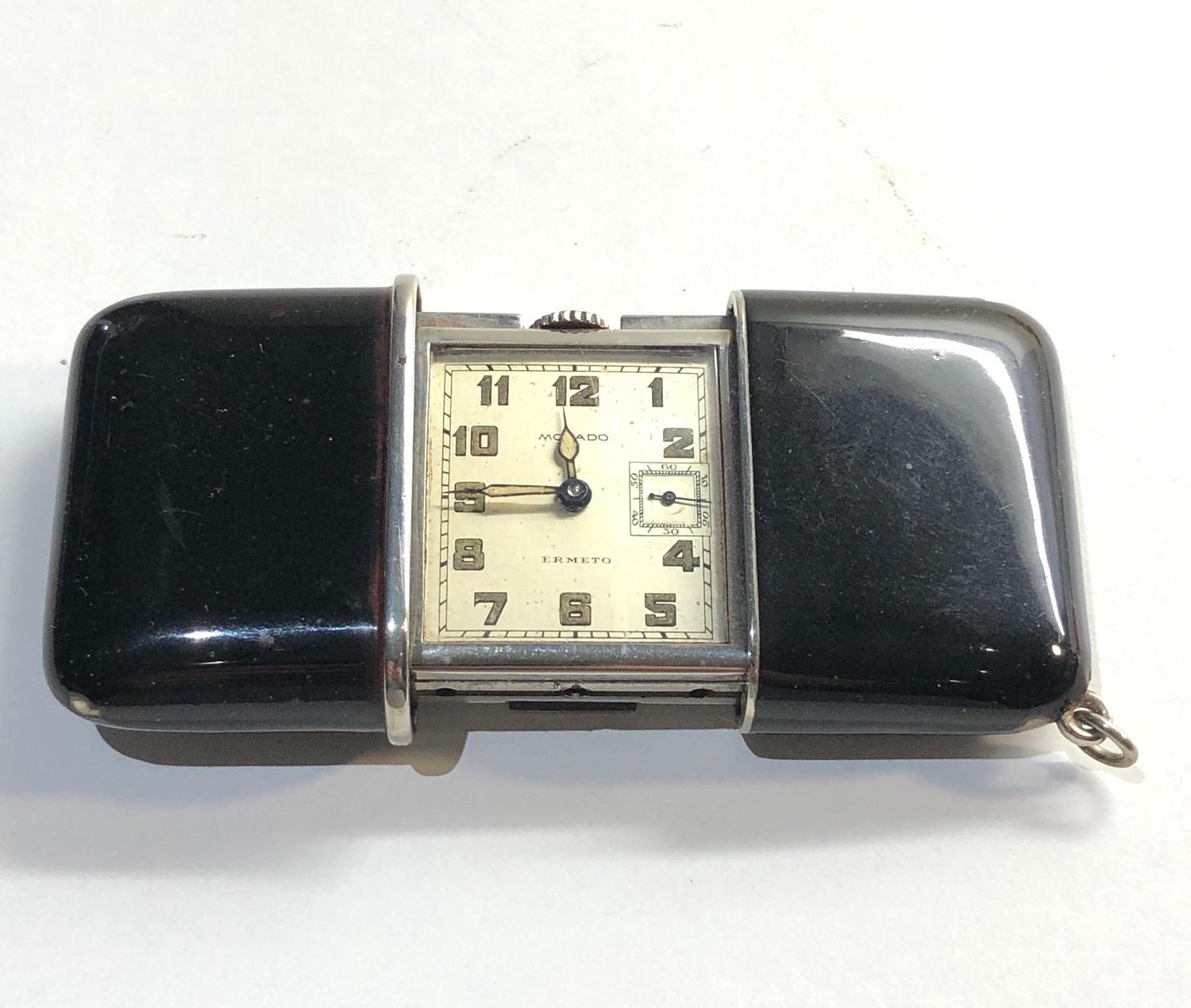 Black enamel Movado Ermeto purse watch in good overall condition edge chips to enamel