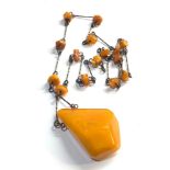 large egg yolk amber pendant and amber bead necklace