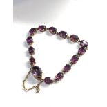 9ct gold amethyst coloured gem set bracelet