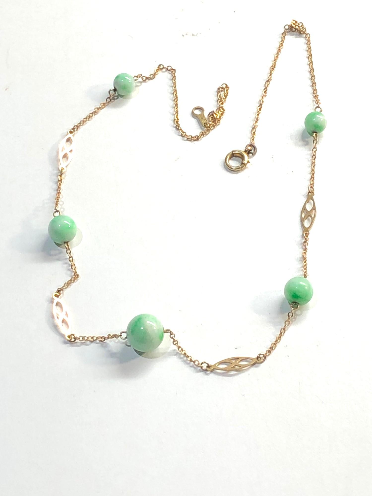 9ct gold jade necklace, overall good condition, largest jade bead measures approximately 9mm - Image 2 of 3