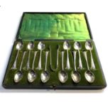 Boxed set of 12 silver tea spoons and sugar tongues by walker and hall