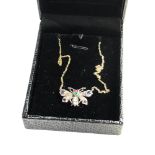 Rose diamond sapphire and gem set butterfly pendant on chain set in silver and gold measures