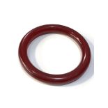 Vintage cherry amber bakelite bracelet has internal swirls measures approx 8.2cm dia weight 22.7g