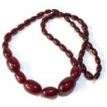 Antique cherry amber / bakelite bead necklace largest bead measures approx 2.5cm by 1.7cm weight 42g