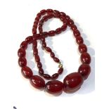 Antique cherry amber / bakelite bead necklace largest bead measures approx 3.1cm by 2.3cm weight 90g