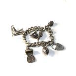 Heavy vintage silver charm bracelet 90g some charms loose