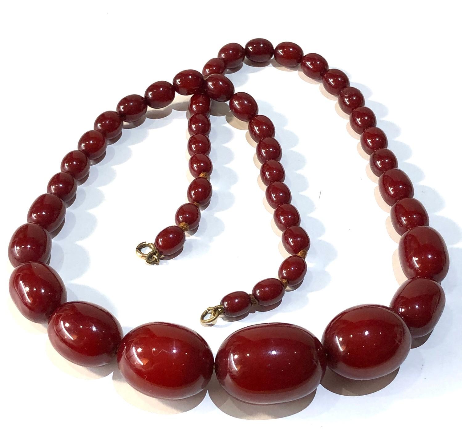 Antique cherry amber / bakelite bead necklace largest bead measures approx 3.2cm by 2.3cm weight 71g - Image 2 of 4
