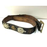 Large leather belt with military cap badges
