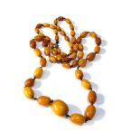 Antique Egg yolk amber bead necklace largest bead measures approx 1.9cm by 1.5cm weight 25g good