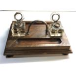 Antique oak ink stand with matching glass ink wells stand measures approx 30cm by 21cm in good