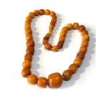 Antique Egg yolk amber bead necklace largest bead measures approx 2cm by 2cm weight 40g good colour