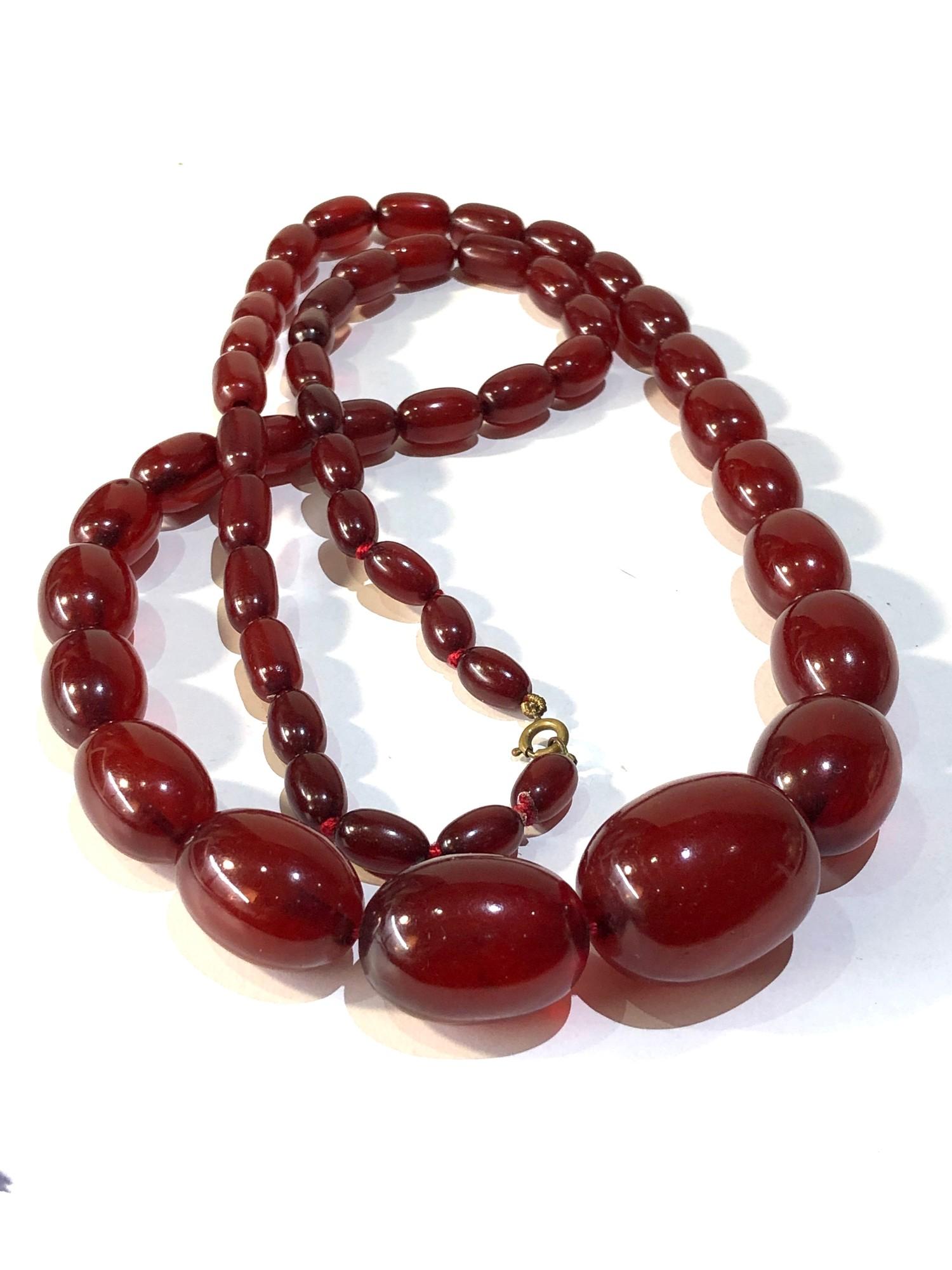 Antique cherry amber / bakelite bead necklace largest bead measures approx 3.1cm by 2.3cm weight 90g - Image 2 of 4