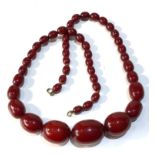 Antique cherry amber / bakelite bead necklace largest bead measures approx 3.2cm by 2.3cm weight 71g