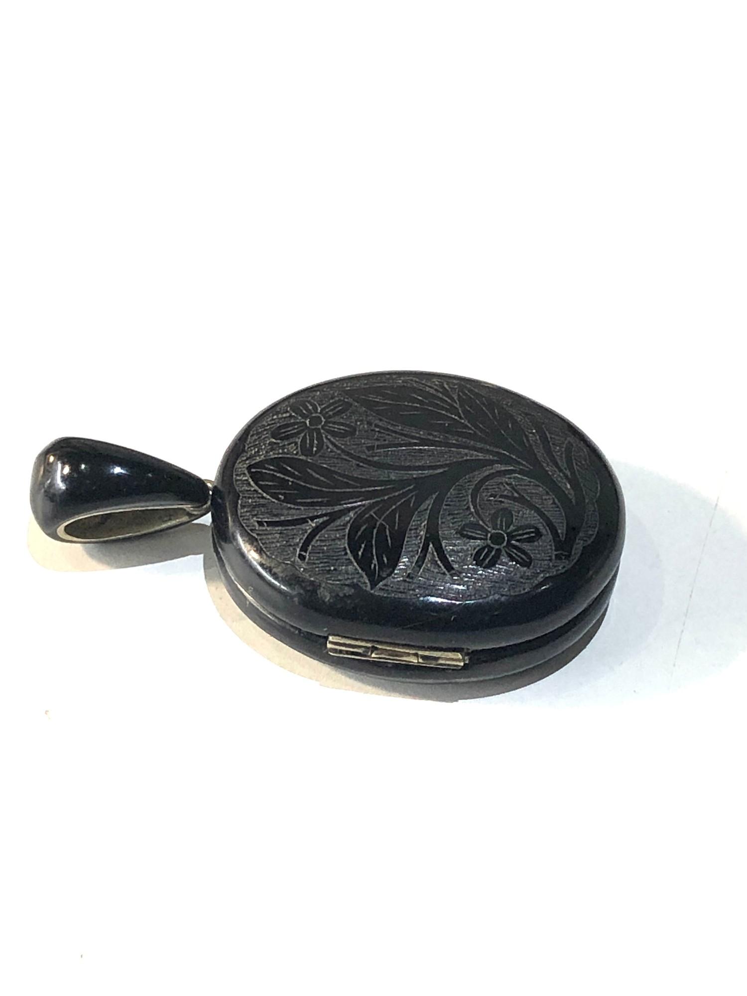 Antique Victorian whitby Jet Locket in good condition measures 6cm by 3.6 cm widest points closed