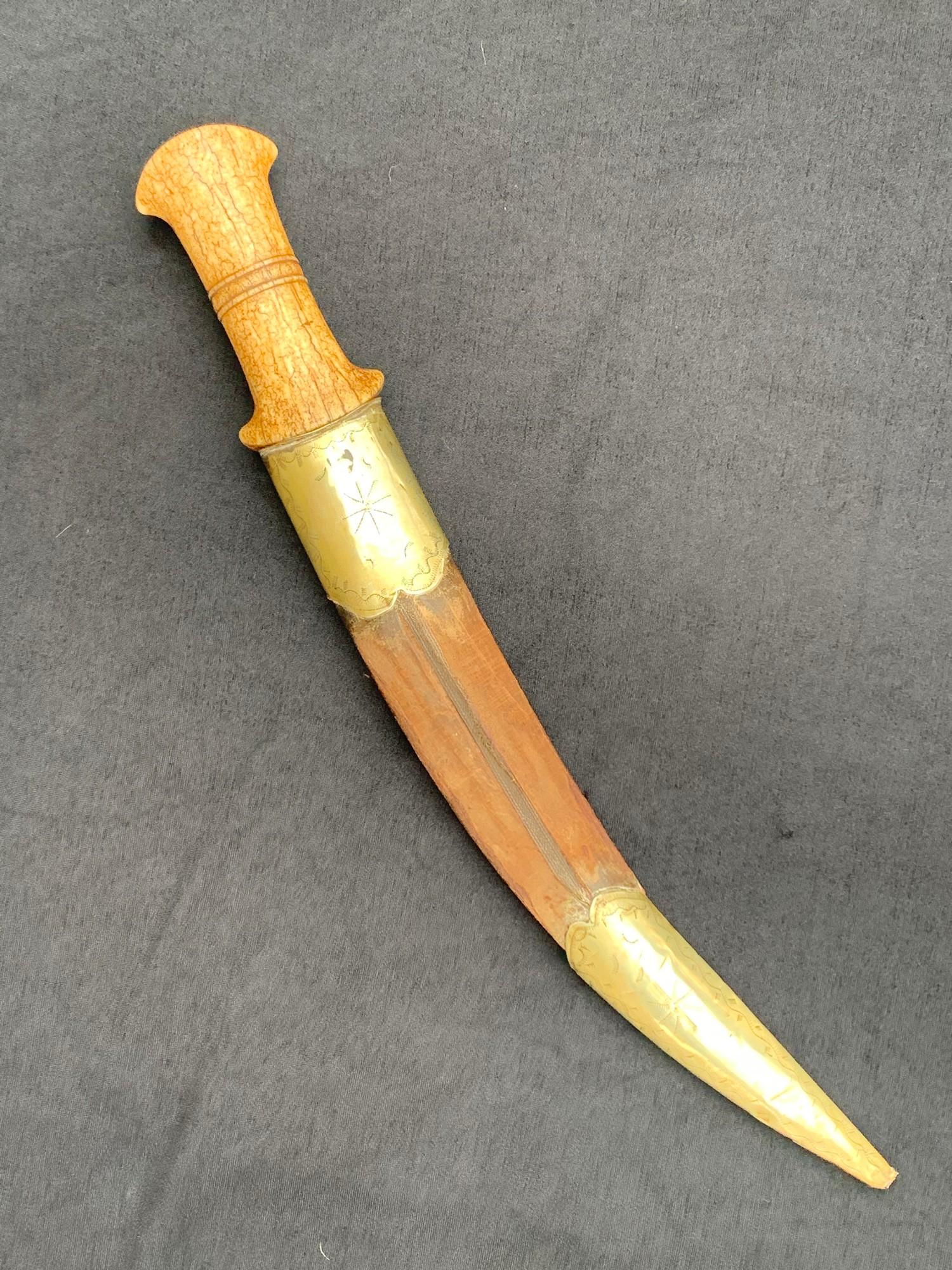 Large 18th / 19th century dagger probably caucasus with walrus grip the blade chiselled with naive