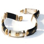 9ct gold Chinese stone panel and gold script bracelet measures approx 9cm long 1cm wide in good