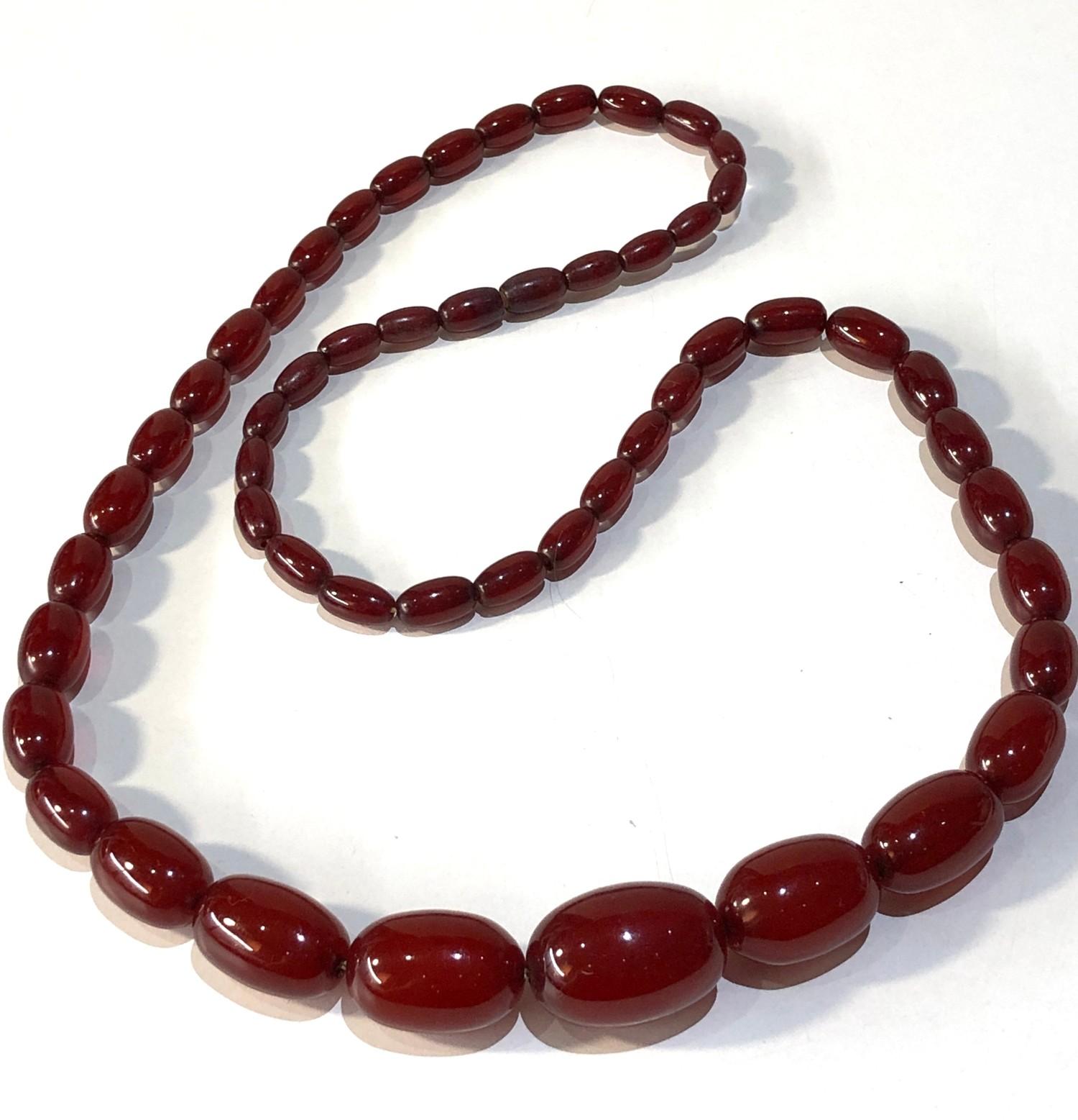 Antique cherry amber / bakelite bead necklace largest bead measures approx 2.5cm by 1.7cm weight 44g