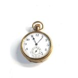 Antique gold plated open face pocket watch winds and ticks but no warranty given