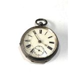 Antique silver open faced pocket watch the watch winds and ticks but no warranty is given