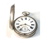 Antique silver open faced pocket watch the watch winds and ticks but no warranty is given