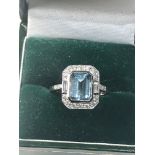 Fine diamond and Aquamarine ring large central aqua is 2.28 ct with diamonds around set in platinum