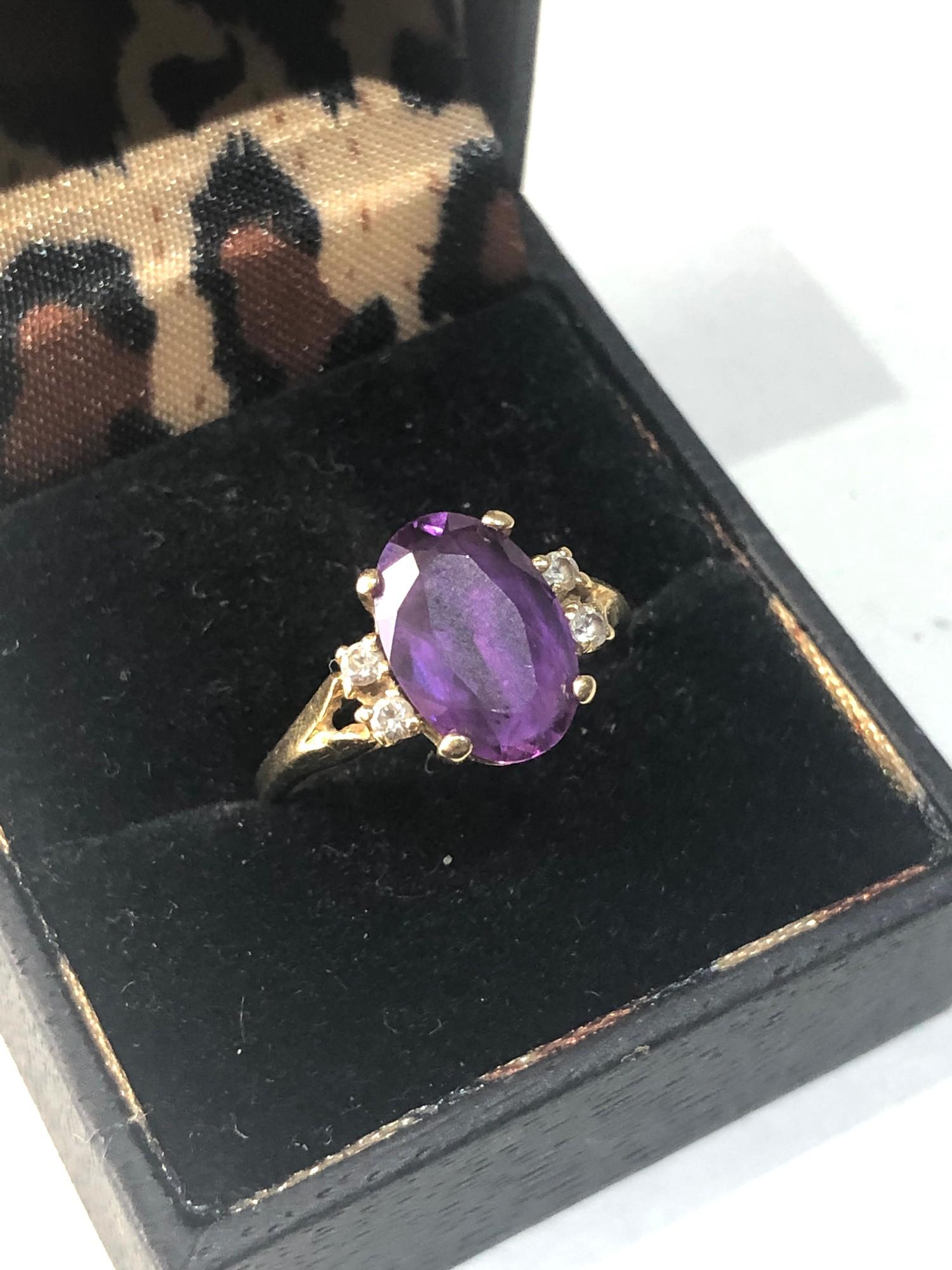 Fine 18ct gold diamond and amethyst ring central sone measures approx 12mm by 8mm weight 4g