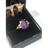 Fine 18ct gold diamond and amethyst ring central sone measures approx 12mm by 8mm weight 4g