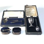 selection of silver items includes silver salts ,babies feeding spoons and boxed silver egg cup