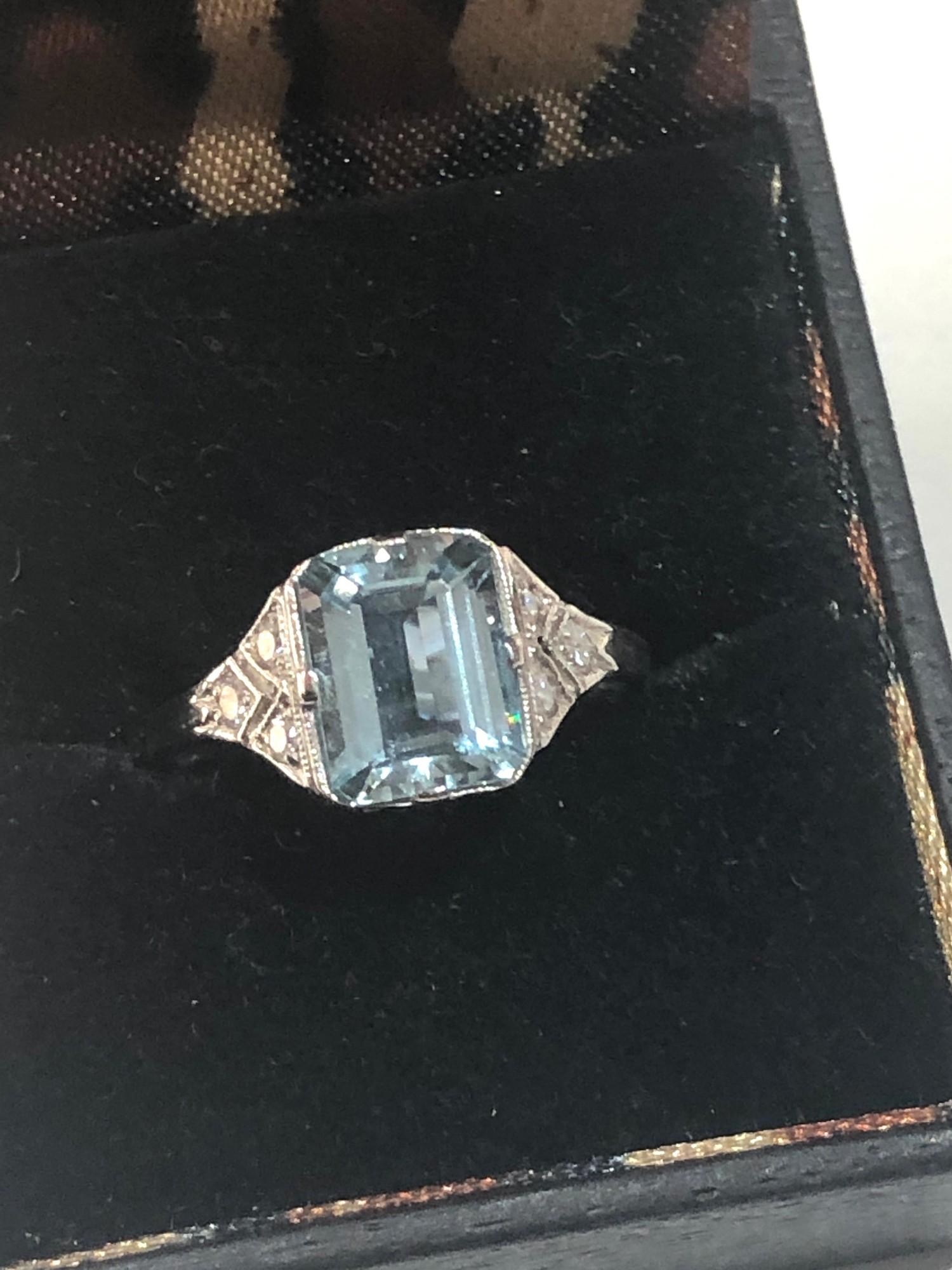 Fine diamond and Aquamarine ring large central aqua is 2.40 ct with diamonds around set in platinum